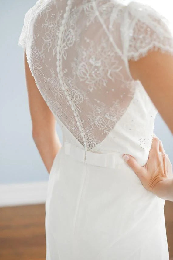 Bride wearing the A-line lace wedding dress, side view.
