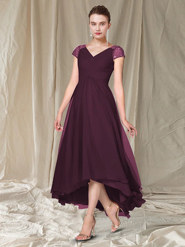 Elegant A-line Mother of the Bride dress with V-neck, cap sleeves, and high-low hem, featuring pleats, beading, and sequins.