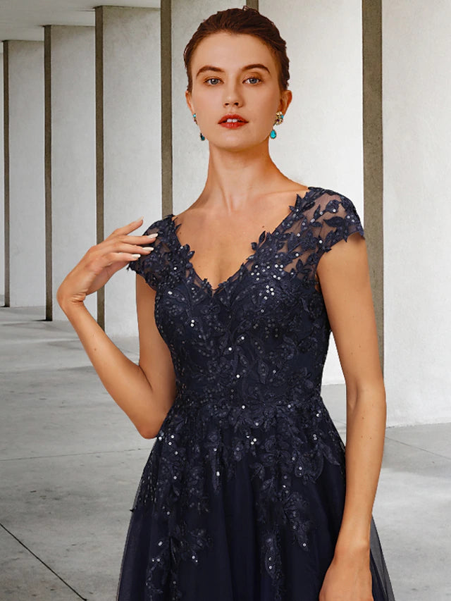 Back view of the floor-length A-Line Mother of the Bride dress, showcasing sequined tulle details.