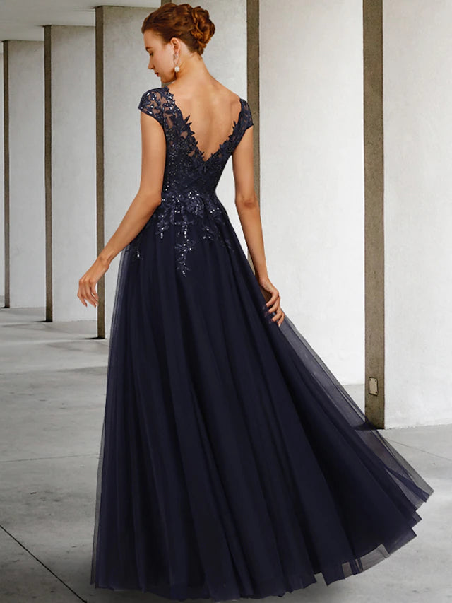 Close-up of the sequin appliques and tulle fabric on the elegant Mother of the Bride gown.
