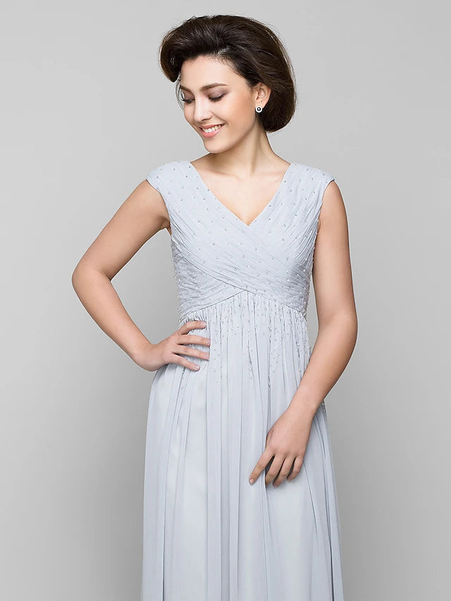 Side view of the sleeveless A-line chiffon dress.