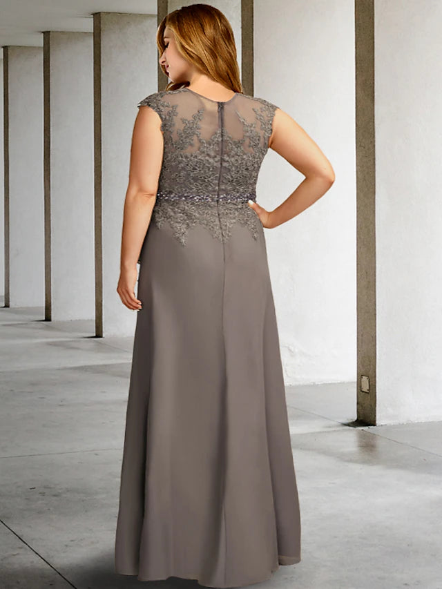 Close-up of the V-neckline and delicate beading appliques on the dress.