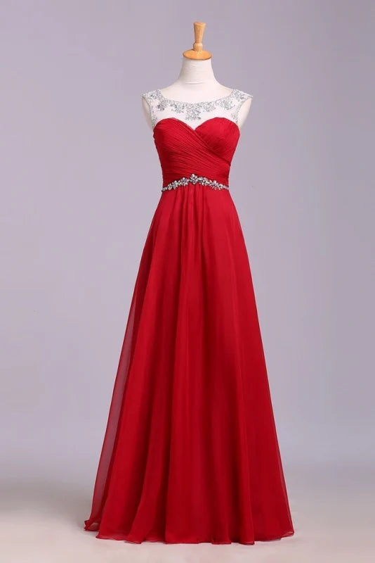 Elegant A-line chiffon prom dress with crystal embellishments and pleated details.