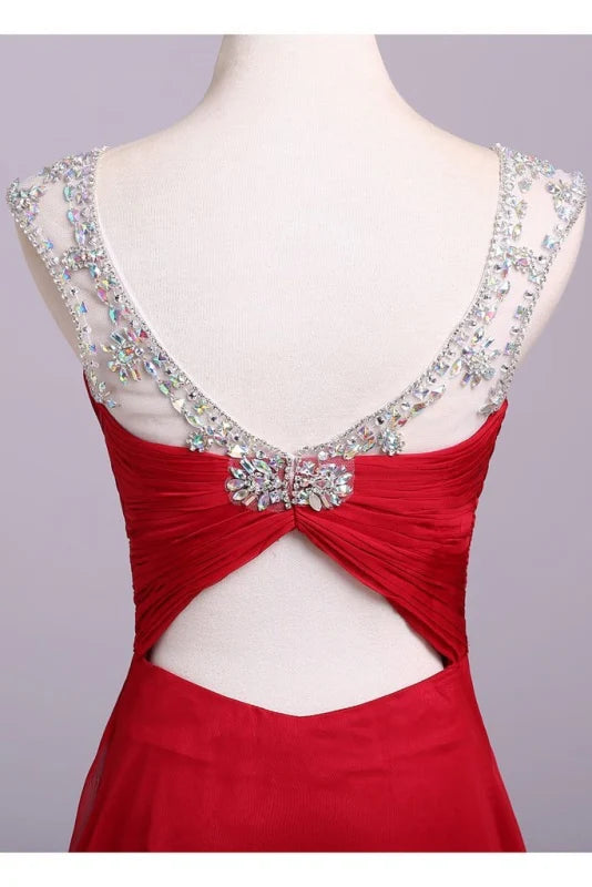 Side view of a woman wearing a pleated A-line evening gown.