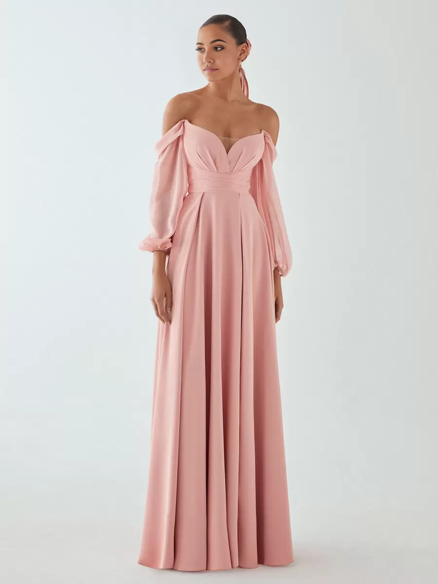 Model wearing a flowy A-Line V-Neck formal evening gown.