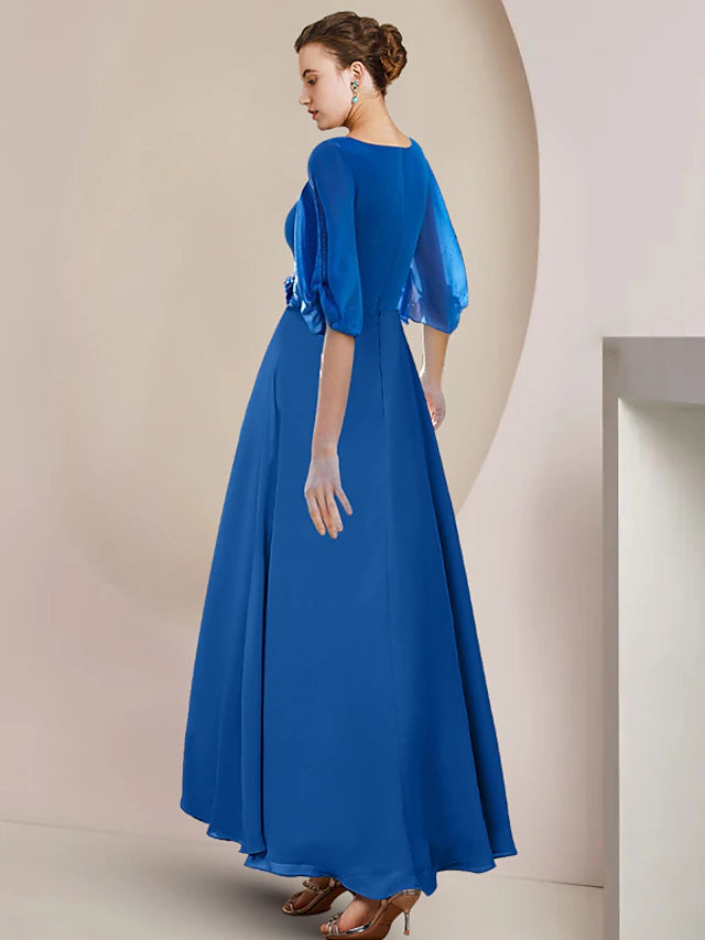 Close-up of the crystal brooch and ruched detail on the A-Line chiffon gown.
