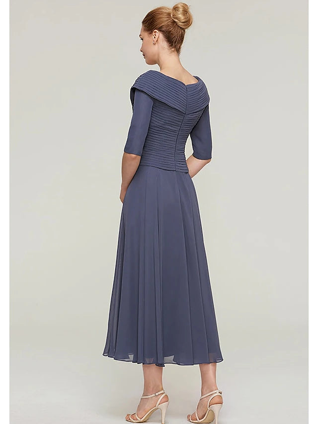 Back view of the chiffon Mother of the Bride dress, showing the half sleeves and flowing fabric.