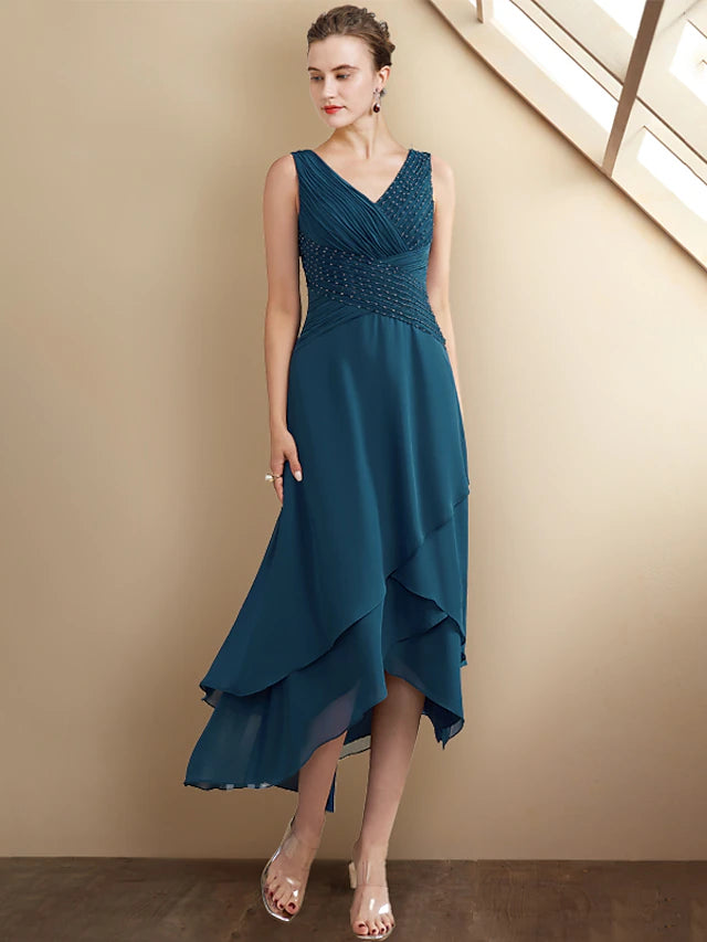 Close-up of the beaded V-neckline on the elegant chiffon dress.