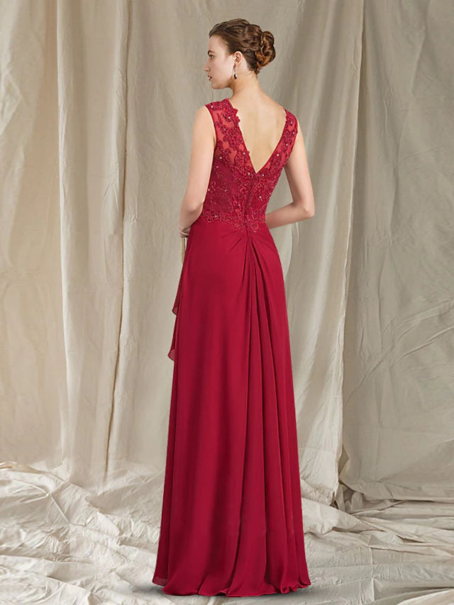 Close-up of the V-neckline and intricate lace appliques on the Mother of the Bride gown.