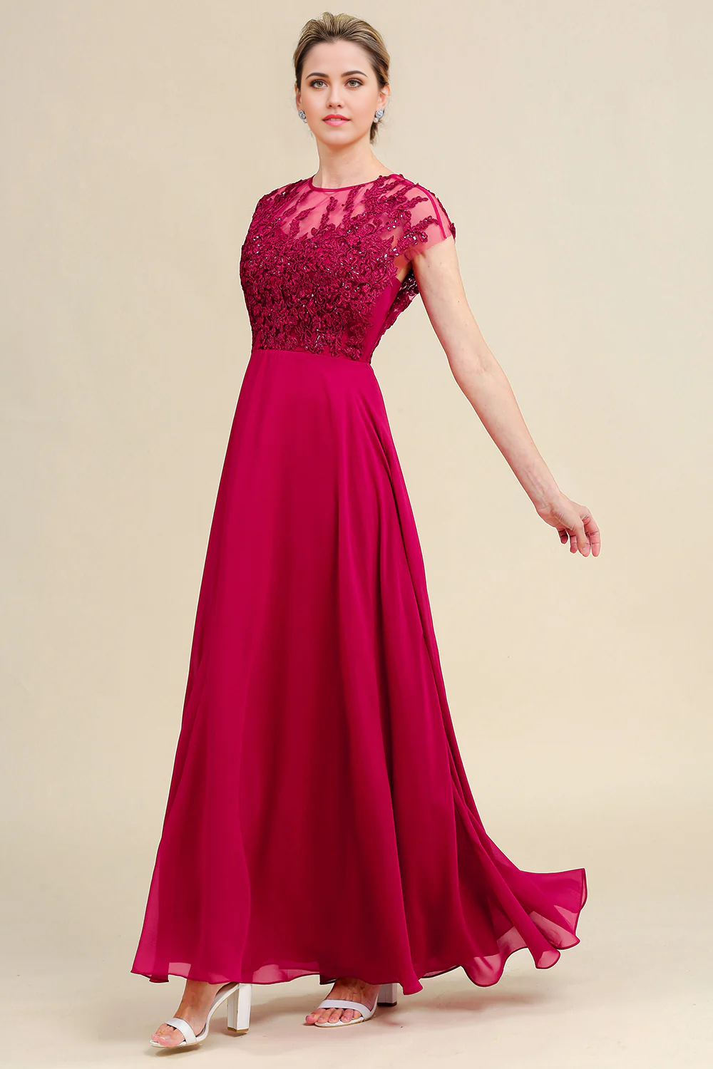 Full length view of the elegant A-line chiffon and lace formal gown.