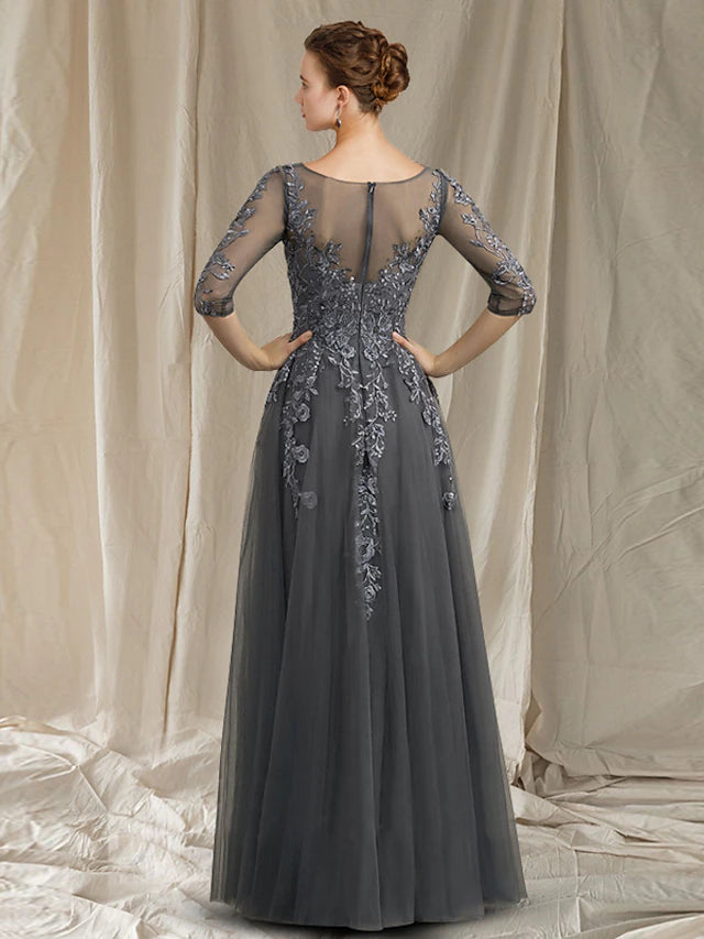 Floor-length chiffon lace gown with intricate appliques and V-neck.