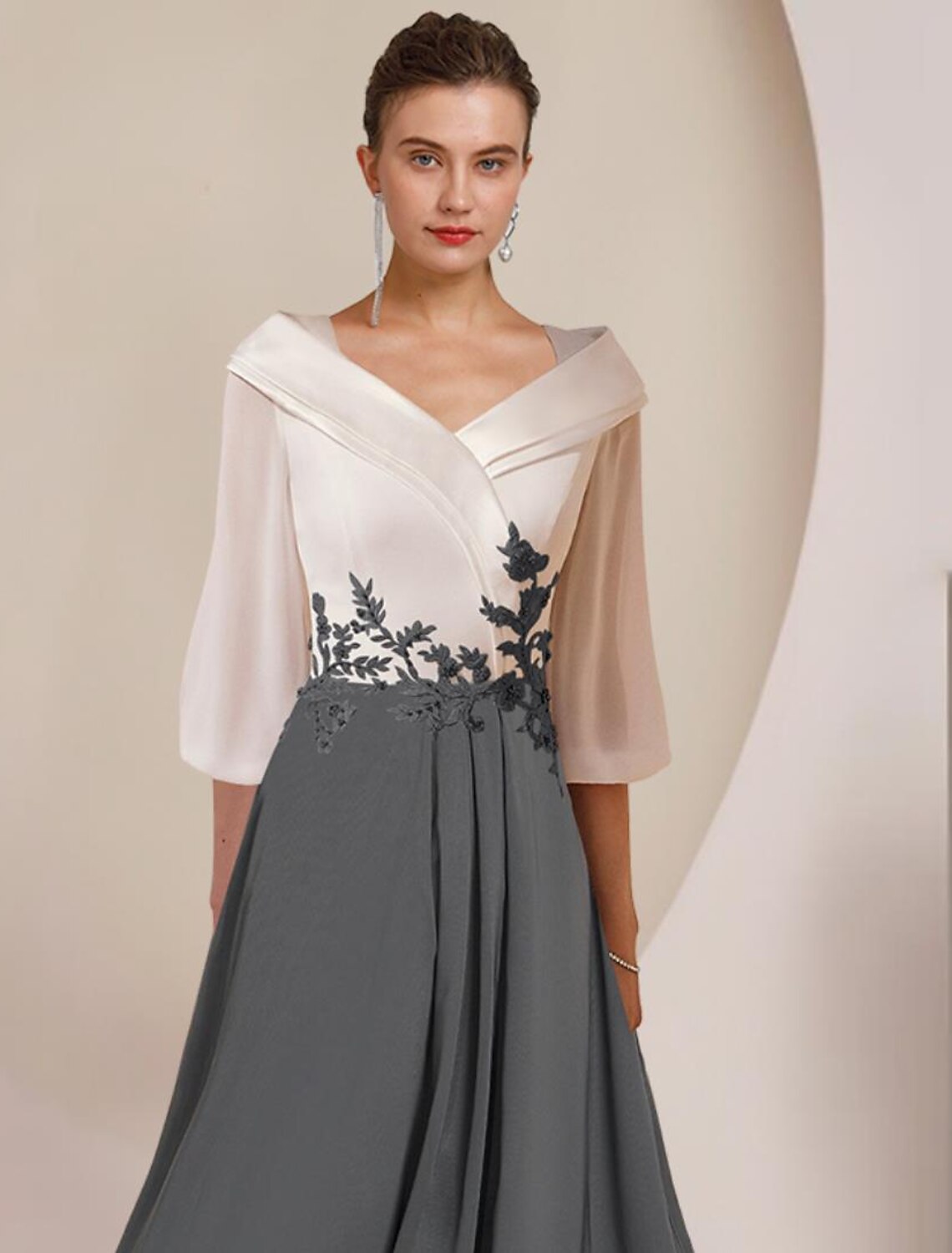 Back view of the elegant A-line chiffon lace dress, showcasing pleats and asymmetrical design.
