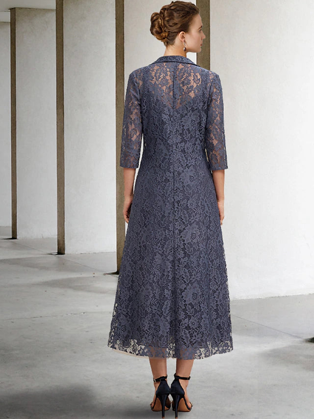 Back view of the A-Line chiffon and lace Mother of the Bride dress with a tiered skirt.