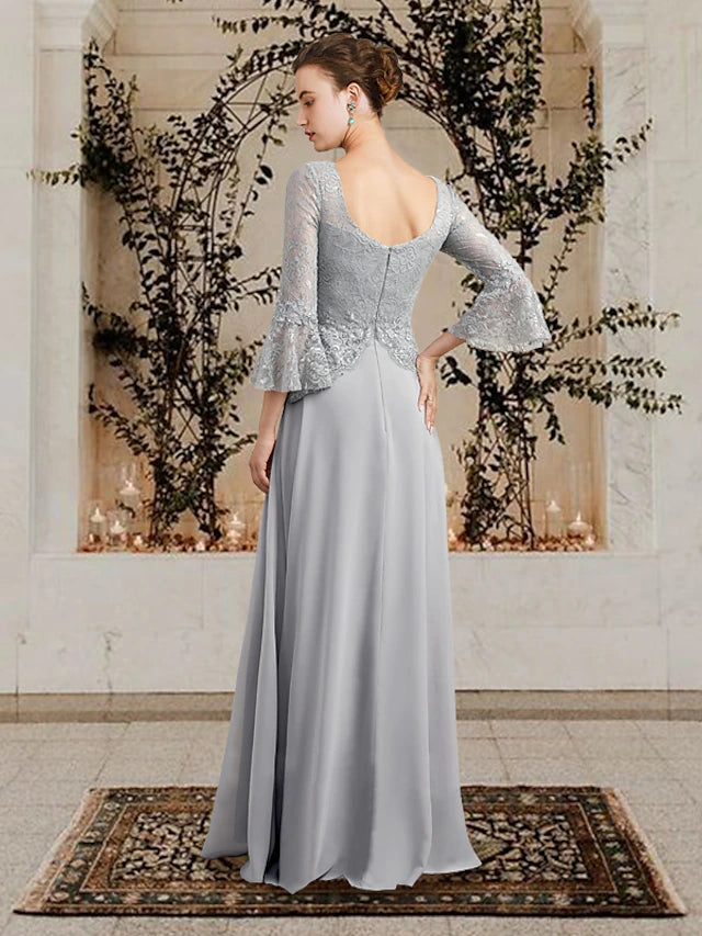 Back view of the floor-length Mother of the Bride gown with flowing chiffon and pleated details.