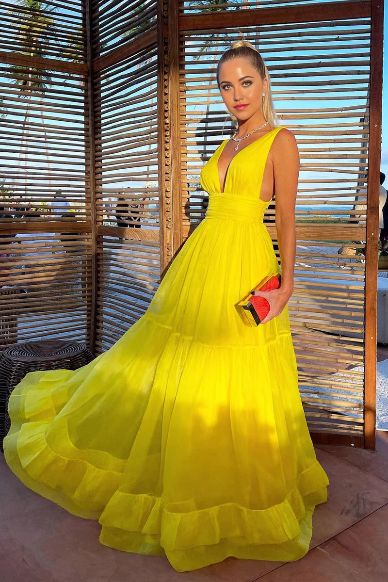 Woman wearing an elegant A-line V-neck chiffon evening dress.