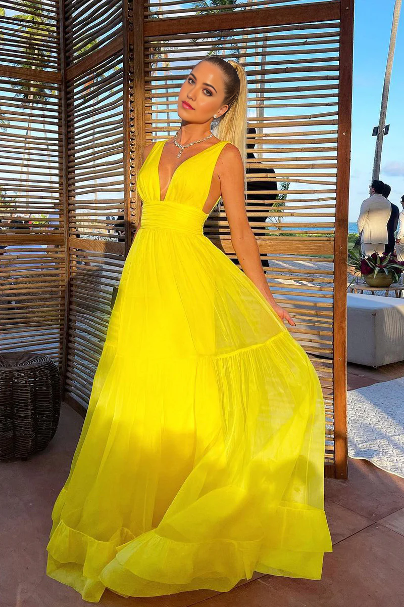 Full view of a flowing A-line V-neck chiffon prom dress.