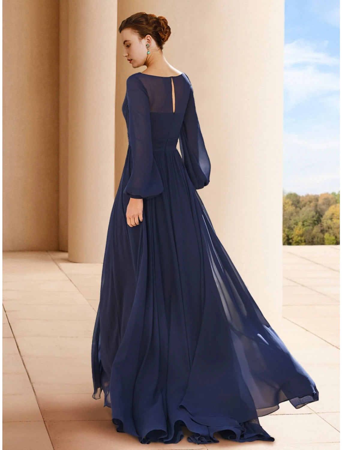 A-line chiffon formal gown with ruched detail and floor length.