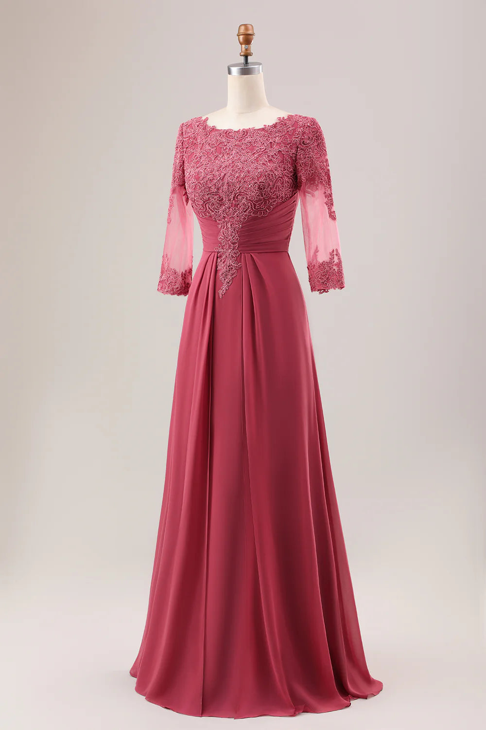 Close-up of the V-neck bodice and intricate appliques on the terracotta chiffon dress.