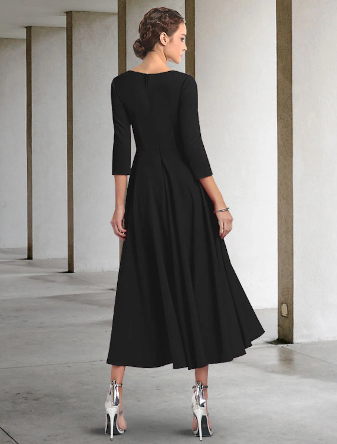 Back view of the chiffon tea length Mother of the Bride dress with pleats.