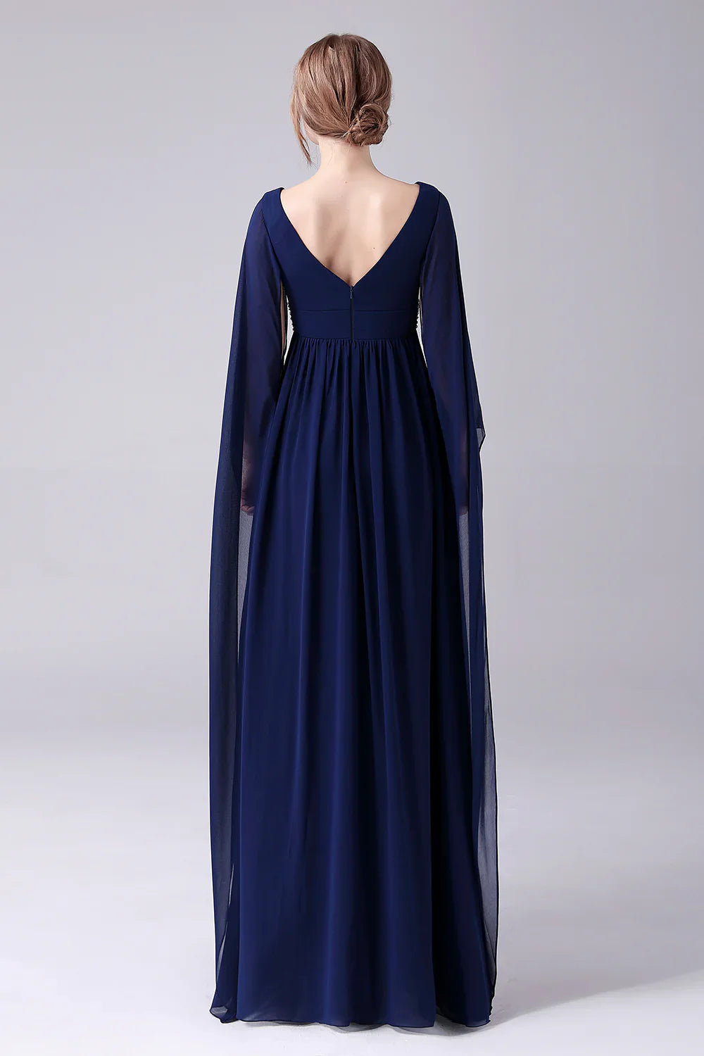 Back view of a pleated chiffon A-line mother of the bride dress.