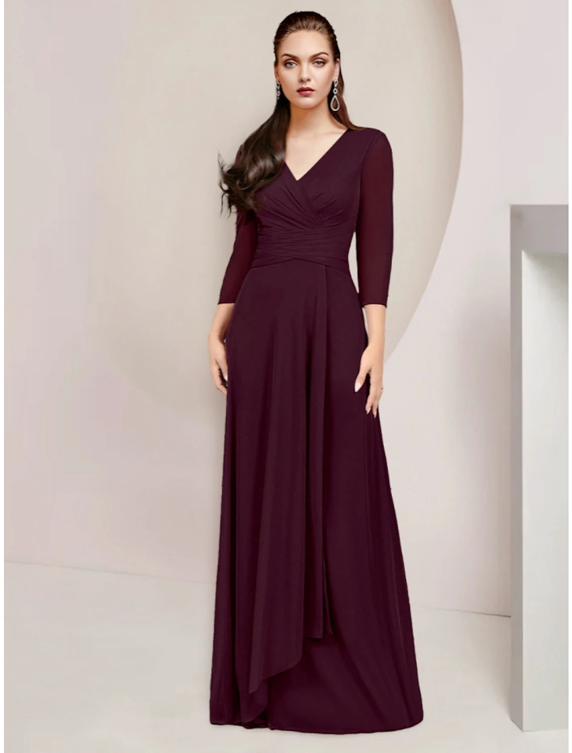 Elegant A-Line V-neck chiffon dress with 3/4 sleeves and ruching on a model.