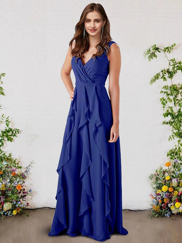 Model wearing an elegant A-line V-neck chiffon bridesmaid dress with ruffles.