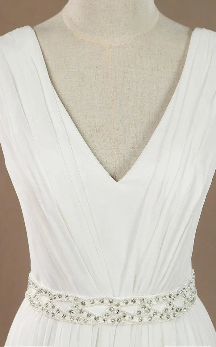 Side view of the flowy A-line chiffon satin wedding dress.