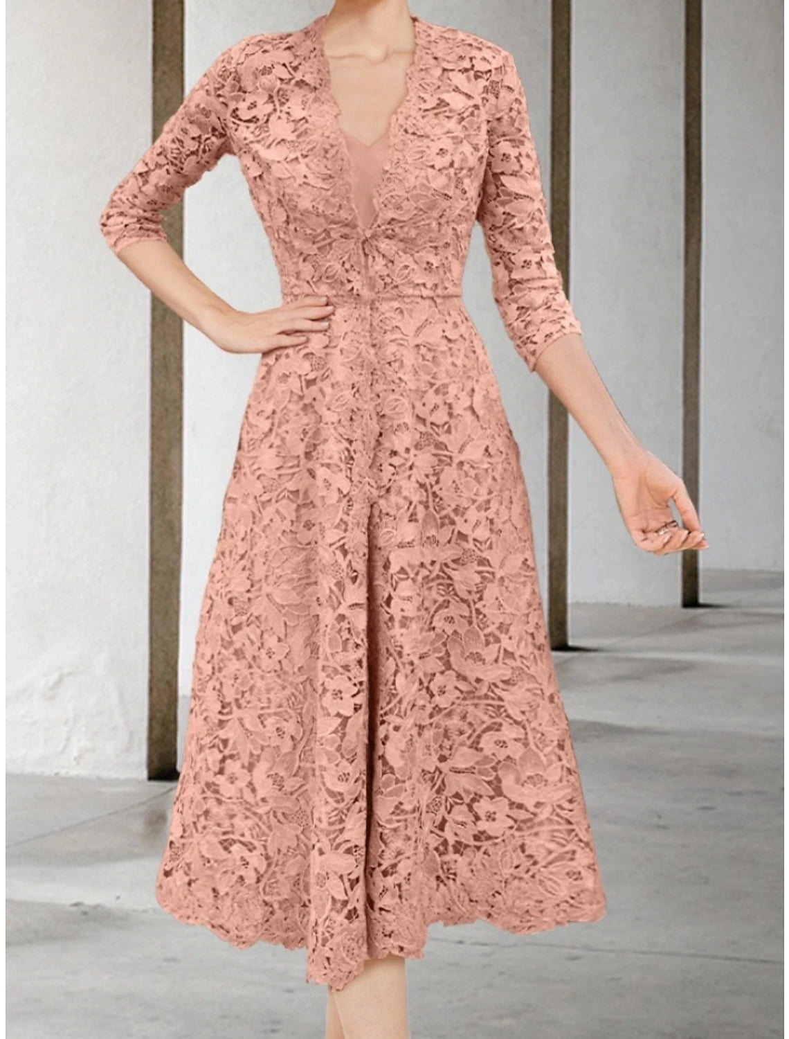 Tea-length Mother of the Bride dress with delicate ruching.