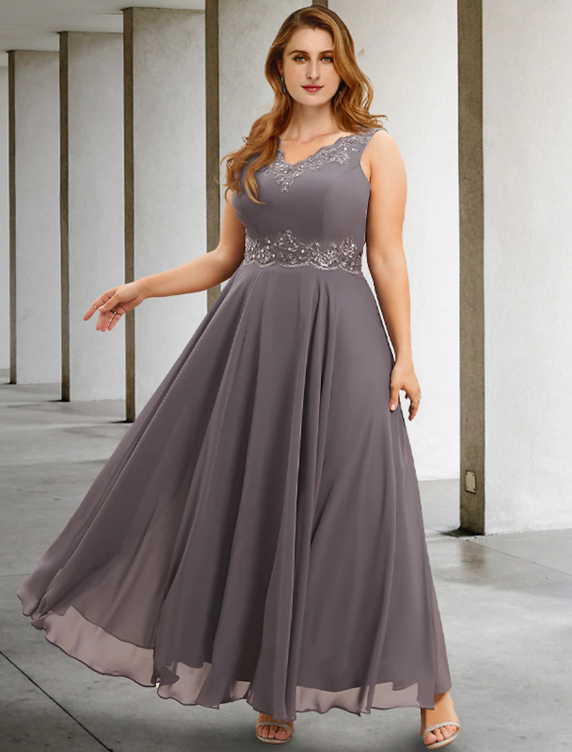 Side view of the A-line chiffon dress, showing the tea-length skirt and sleeveless design.
