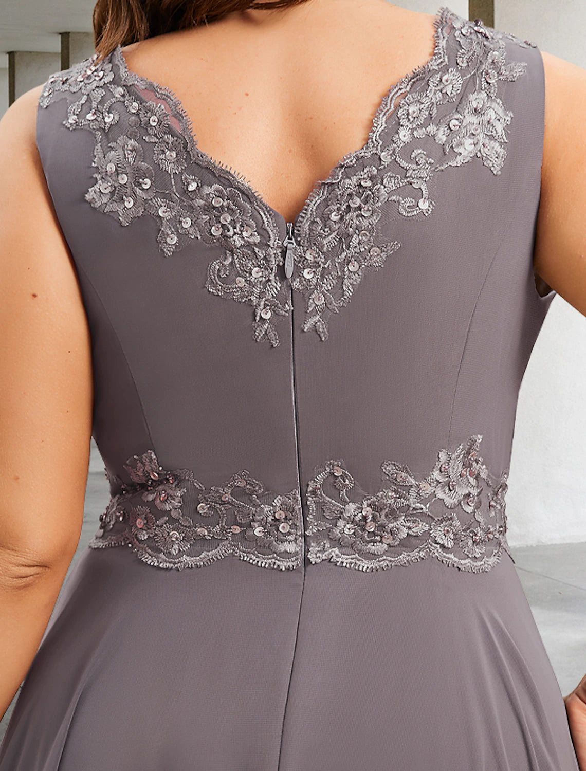 Full length view of the plus-size model wearing the formal A-line dress.