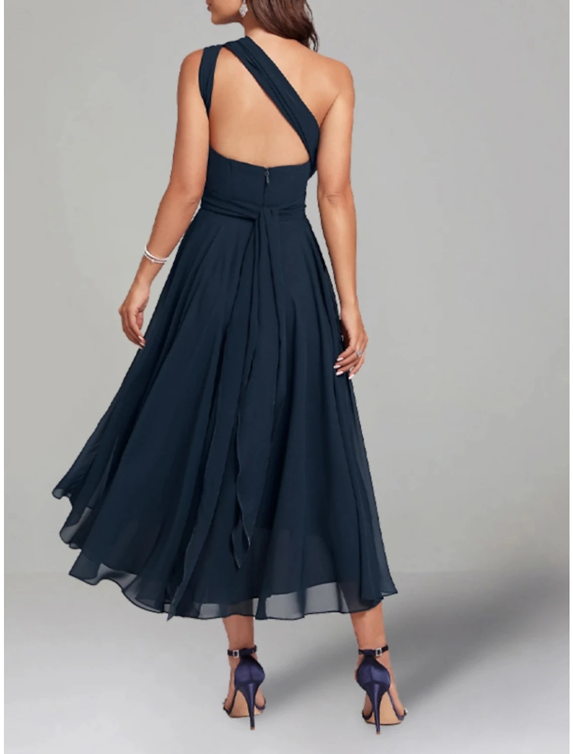 Close-up of the V-neckline and 3/4 length sleeves on the elegant chiffon dress.