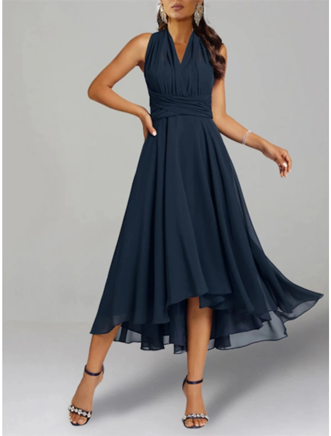 Model wearing the two-piece A-line dress, showcasing its tea length and convertible shawl.