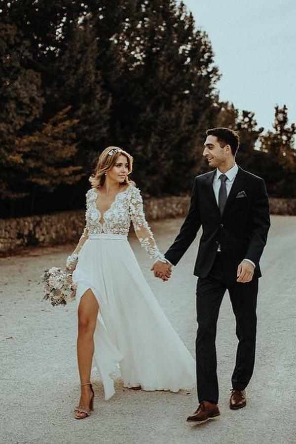 Side view of an A-line V-neck floor-length wedding gown.
