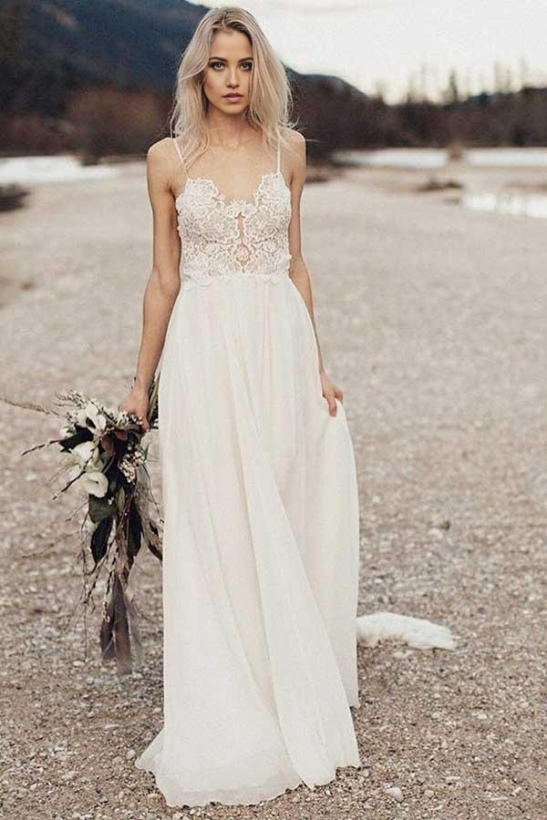 Elegant A-line chiffon wedding dress with spaghetti straps and V-neckline.