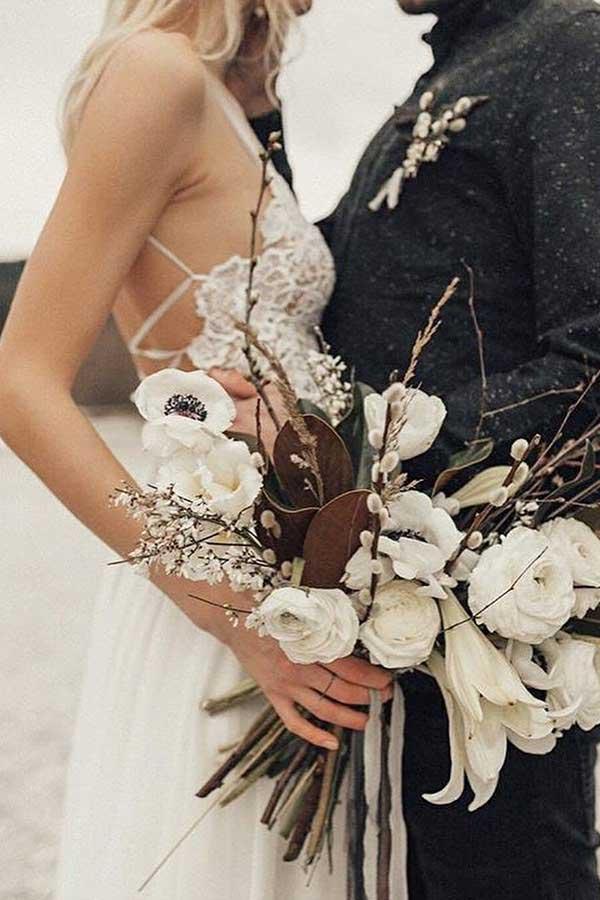 Close-up of lace embellishments on an A-line wedding gown.