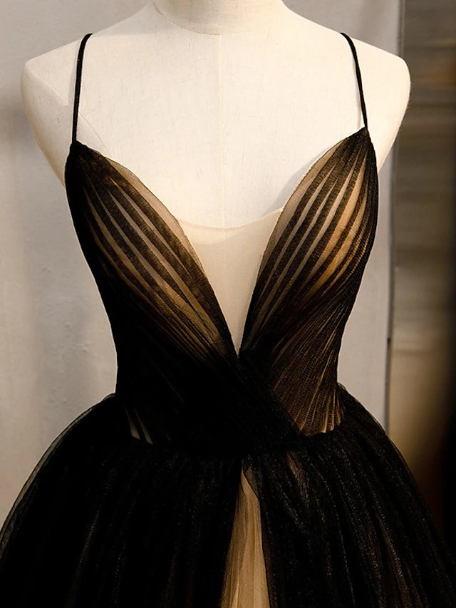 Back view of the A-Line color block gown showing crisscross straps and pleats.