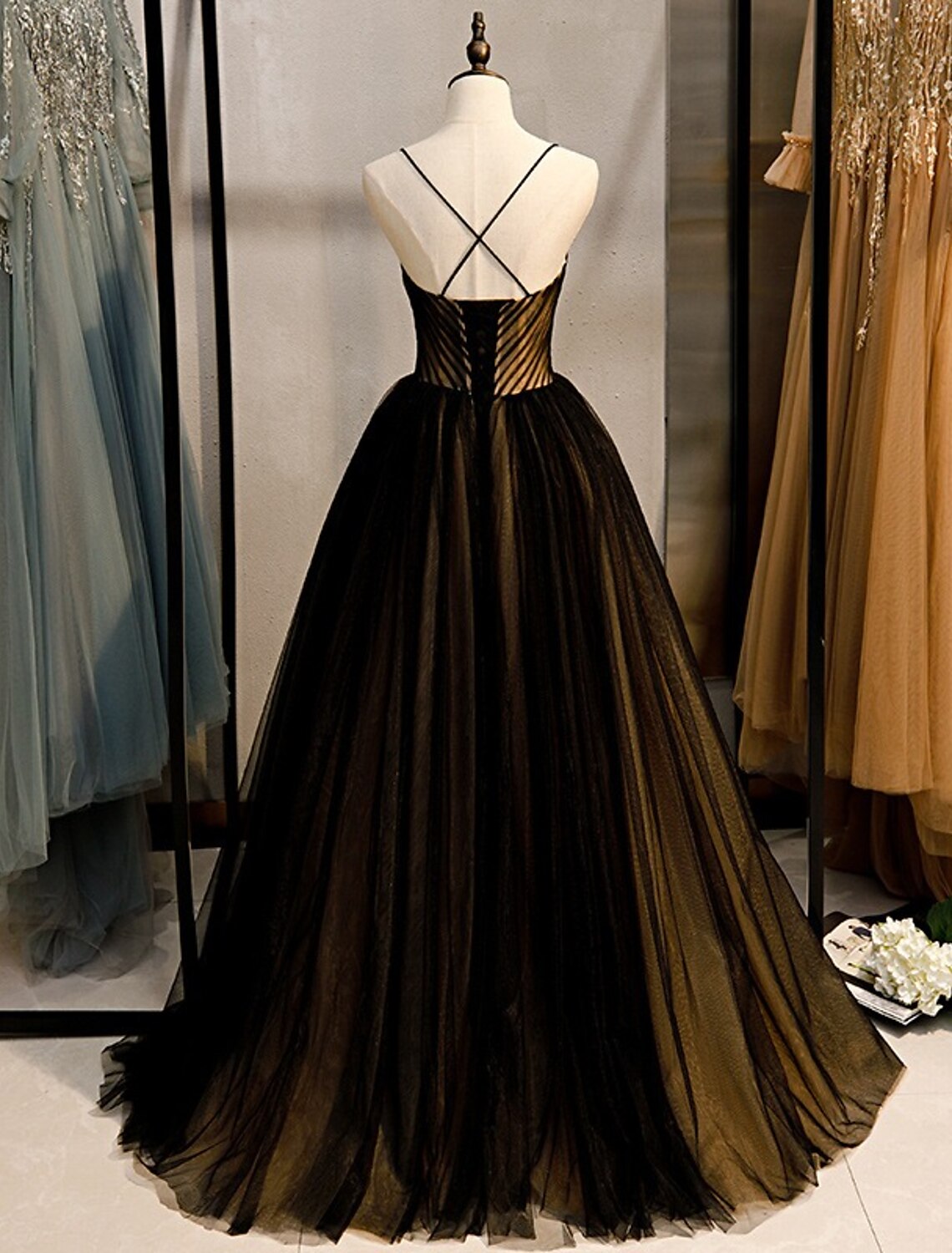 Side view of the A-line color block gown, showcasing the sweep train.
