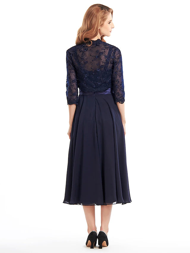 Close-up of lace pleats and appliques on chiffon dress.