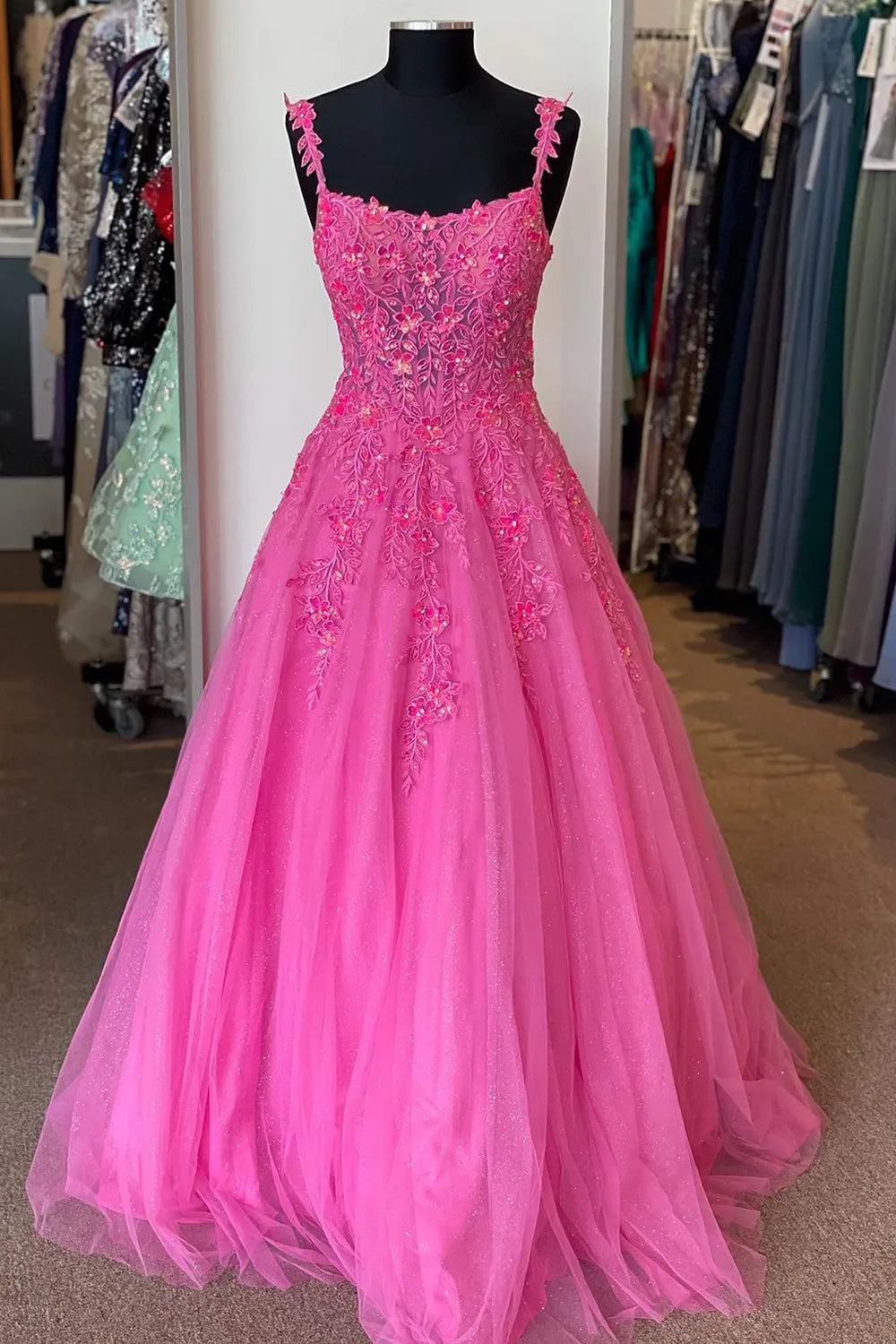 Elegant A-line V-neck prom dress with spaghetti straps and corset applique bodice.