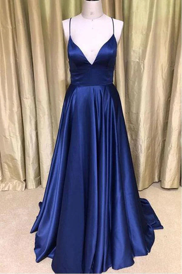 Model wearing a dark green satin V-neck A-line long prom dress.
