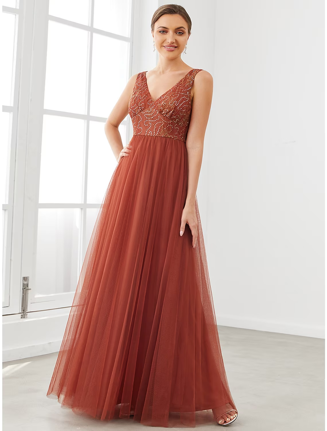 Elegant A-line V-neck tulle prom dress with delicate draping.