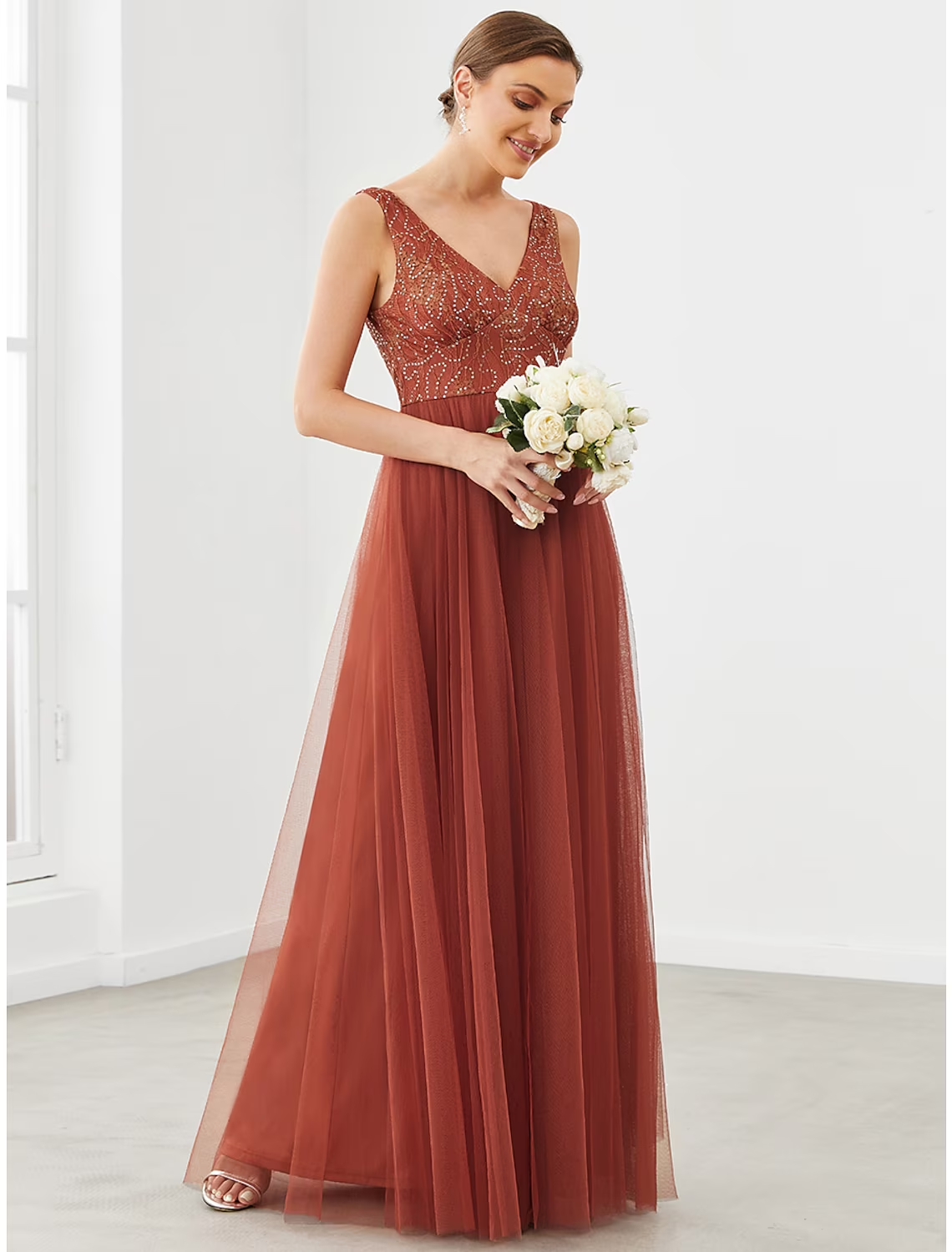Back view of elegant A-line V-neck formal gown.