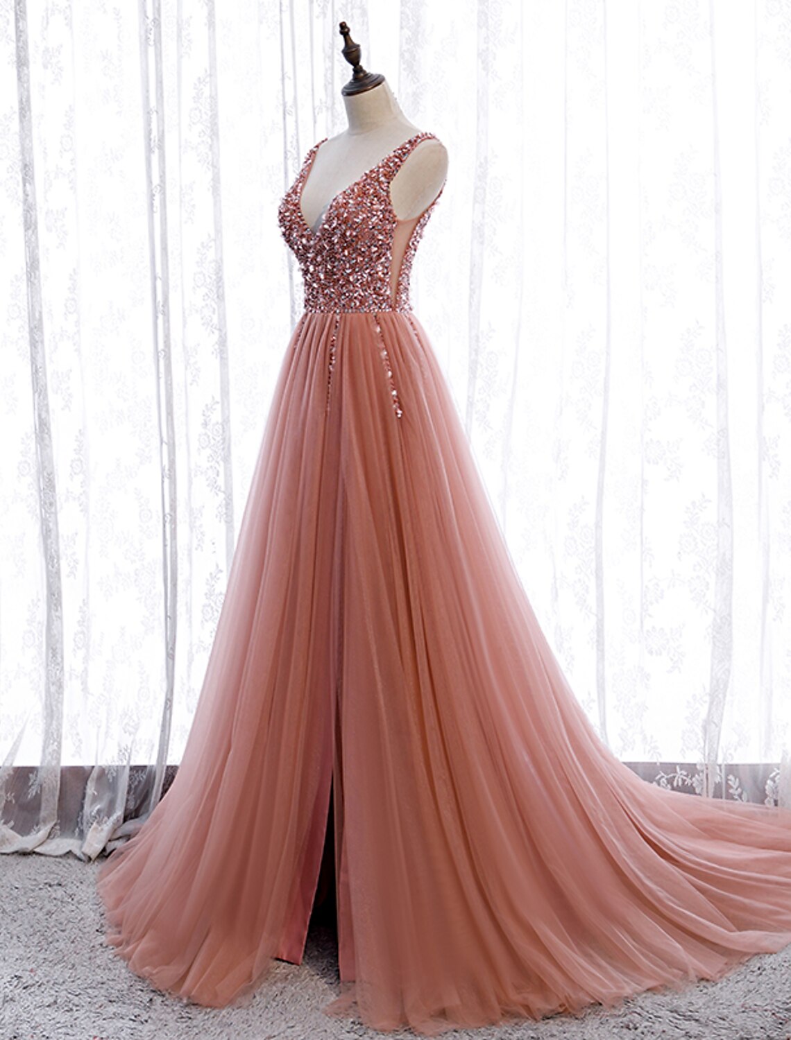 Side view of A-Line V-Neck dress with delicate pearls and court train.
