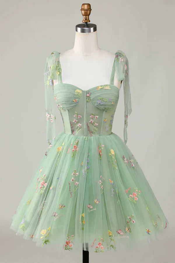 A-Line V-neck short homecoming dress with floral embroidery.