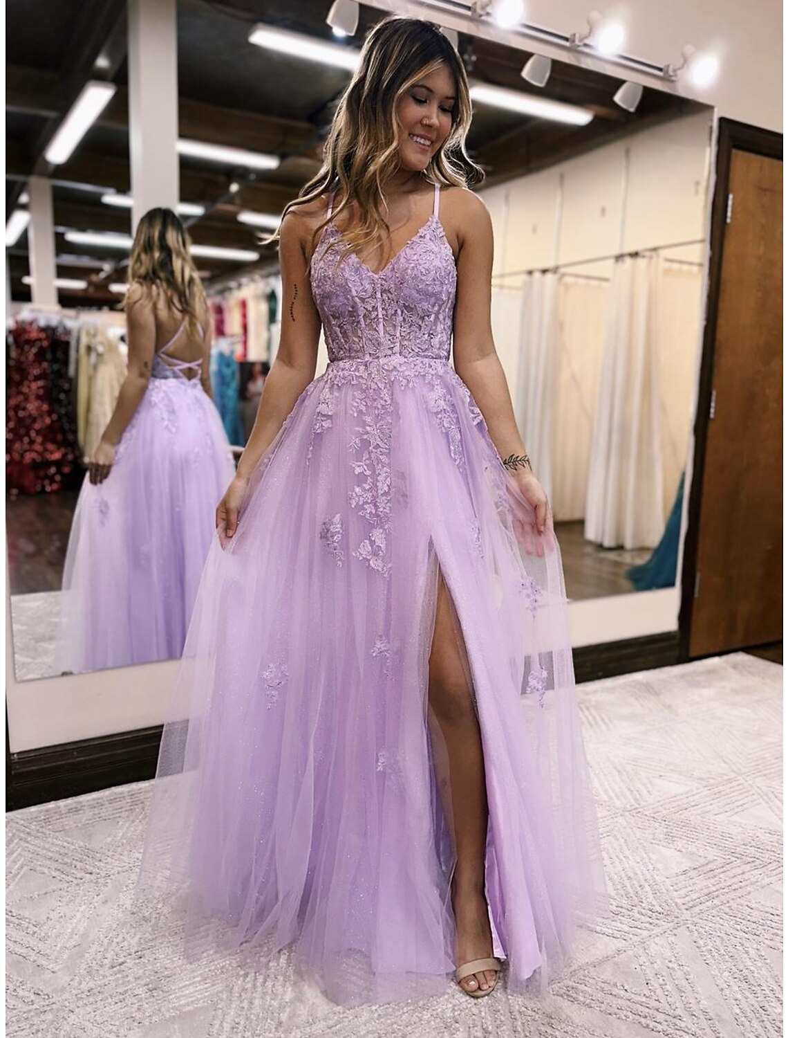 Elegant A-line V-neck evening gown with beading and a front slit.