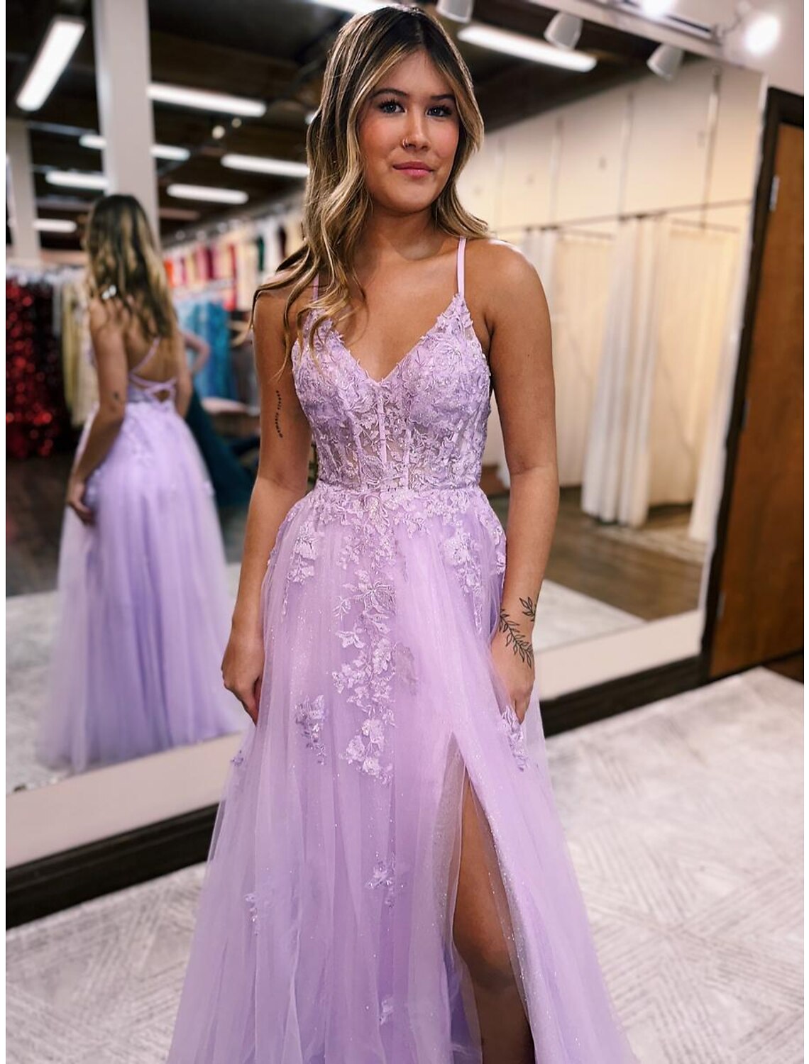 Full-length view of a model wearing the A-line V-neck formal dress.
