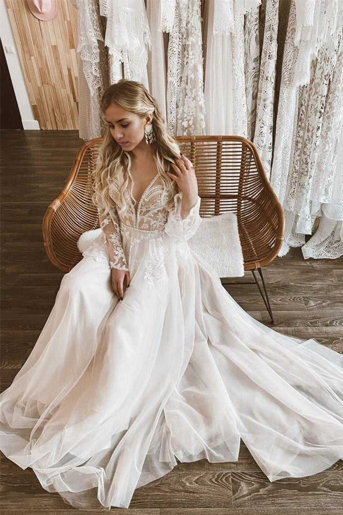 A-Line wedding dress with lace details, flare sleeves, and an open back.