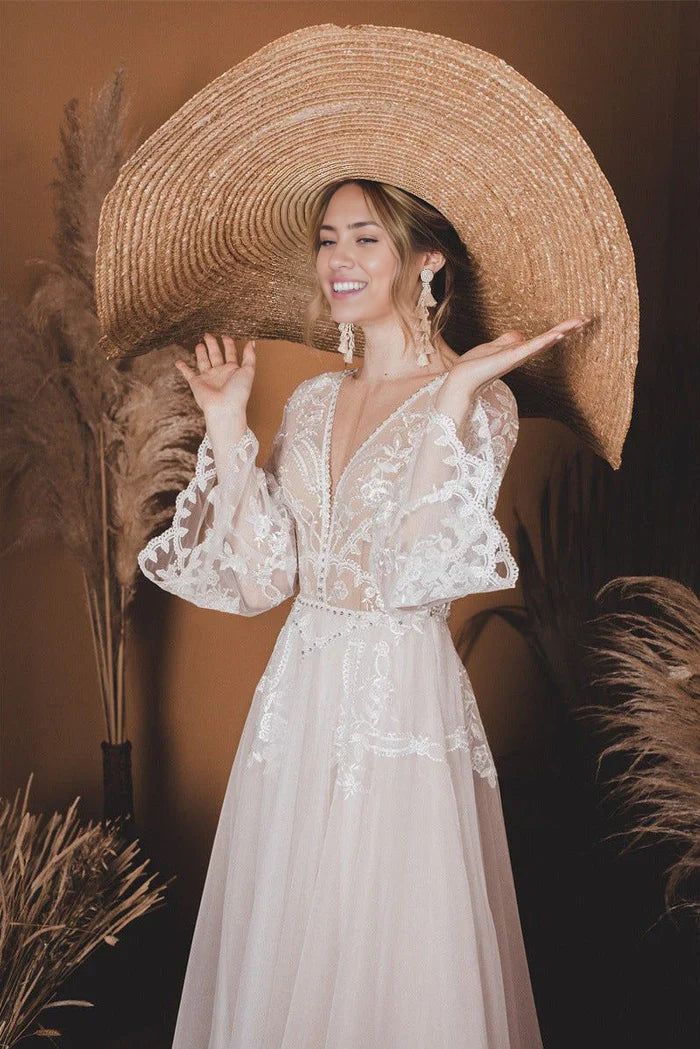 Elegant bridal gown featuring a V-neck, A-line silhouette, and delicate lace.