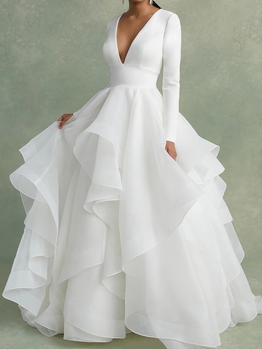 Full length view of the A-Line V-Neck wedding dress with a flowing train.