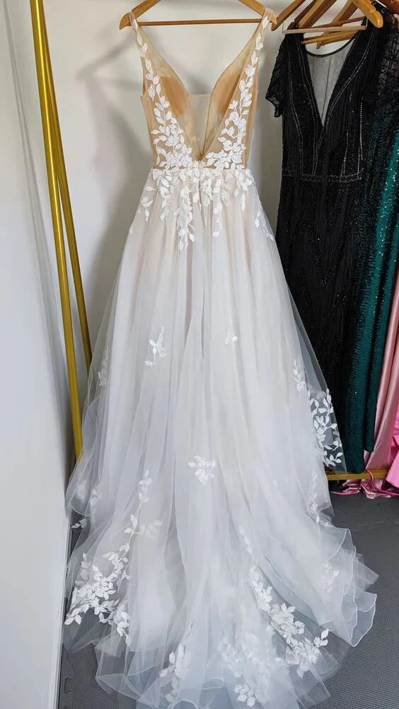 Close-up of the lace detailing on the A-line V-neck wedding dress.
